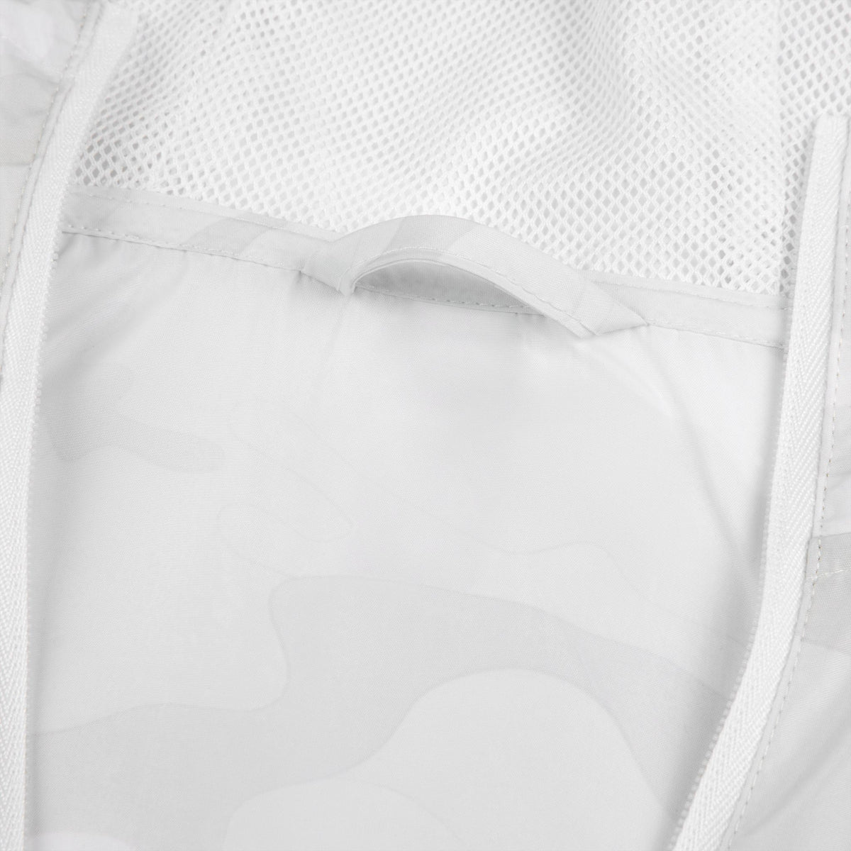 Close-up of white windbreaker jacket fabric