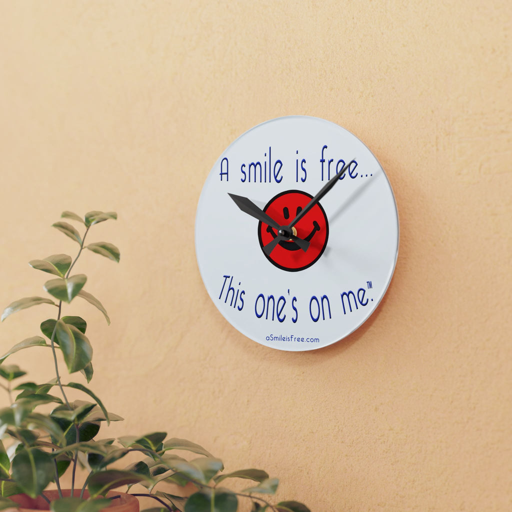 Round acrylic wall clock hanging on wooden wall